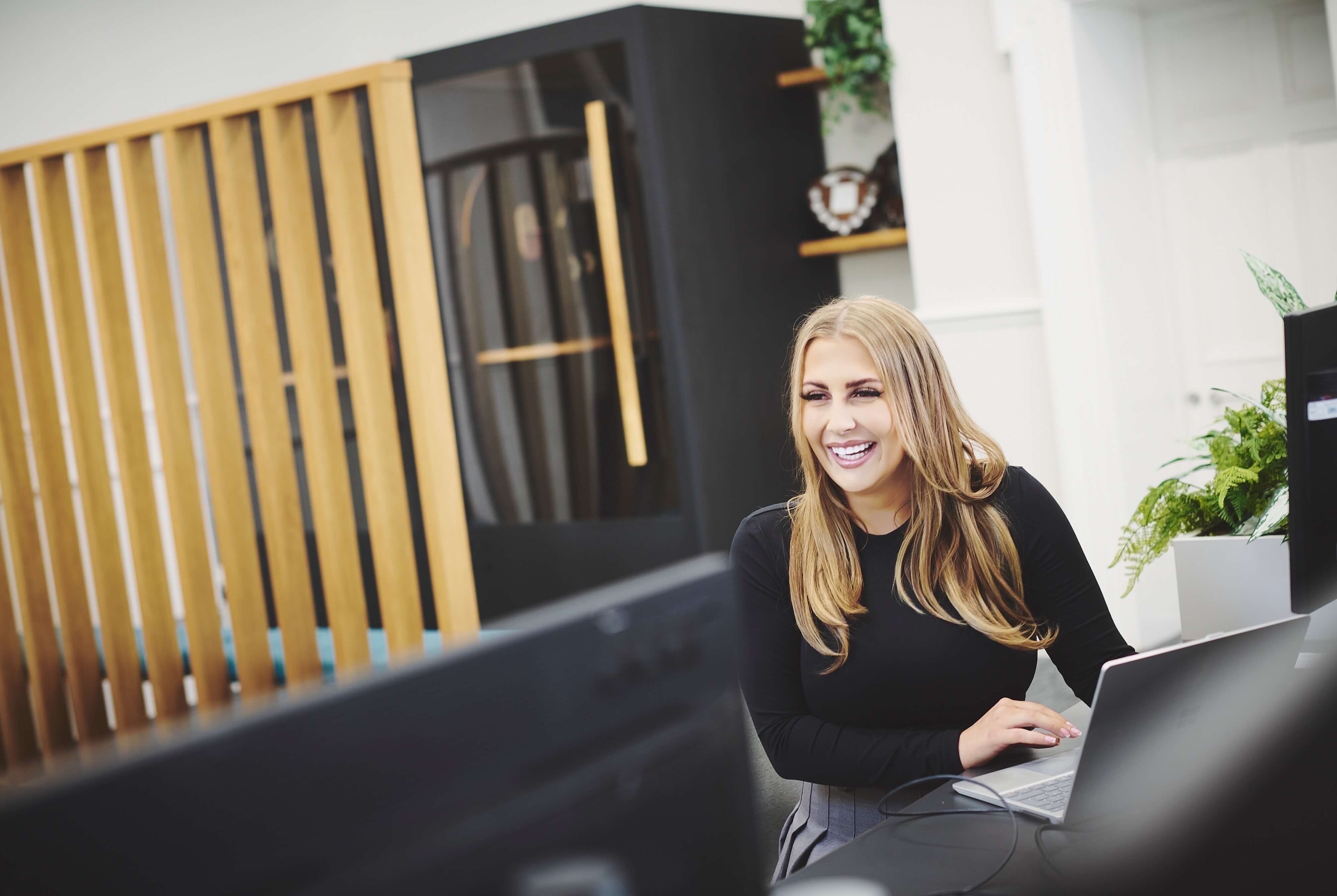 Female office worker smiling